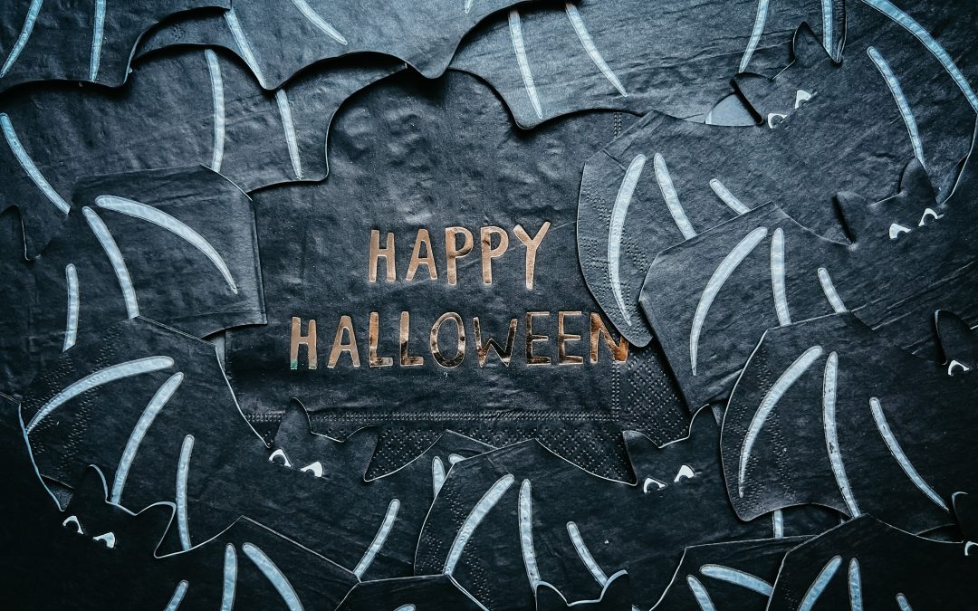 Letters "Happy Halloween" around a black background covered in bats